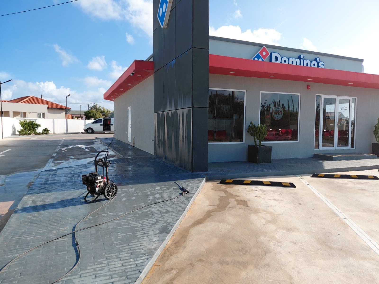 Domino's Pizza full storefront exterior after window cleaning